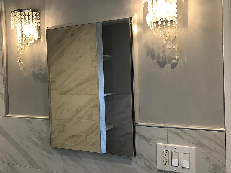 New Bathroom vanity, Chandeliers, and marble tile. Recessed lighting.