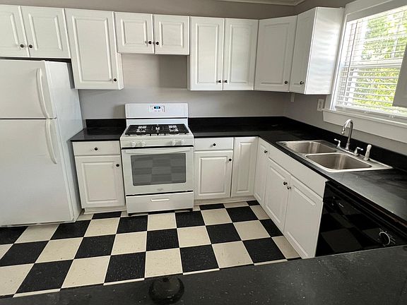 Sunny + updated kitchen, includes ample storage and dishwasher