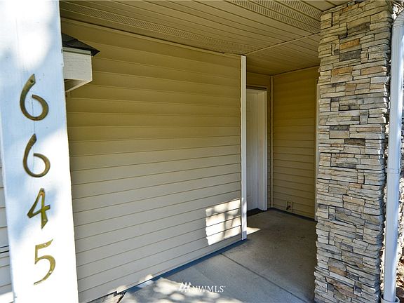 Covered Entry (Storage right of front door, not shown)