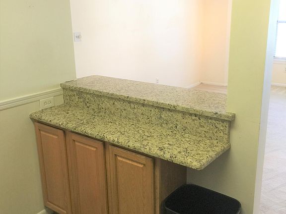Extra custom built granite breakfast area and cabinet storag