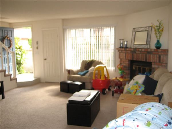 Spacious living area/Brick fireplace