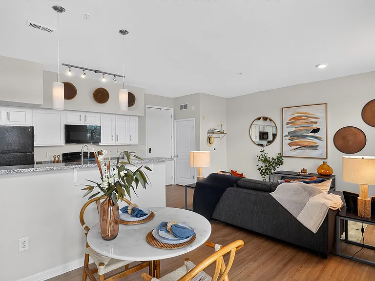 Open-Concept Living Room and Cozy Bedroom at Ralston Apartments in Downtown Indianapolis
