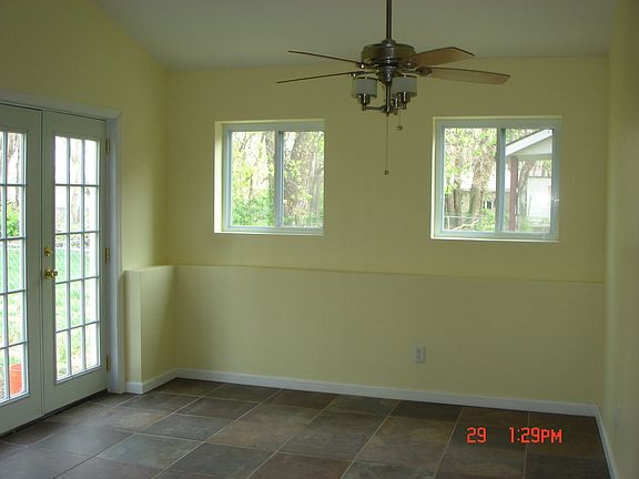 eat in kitchen with french doors and ceiling fan
