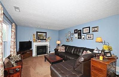 Family Room features Wood Burning Fireplace.