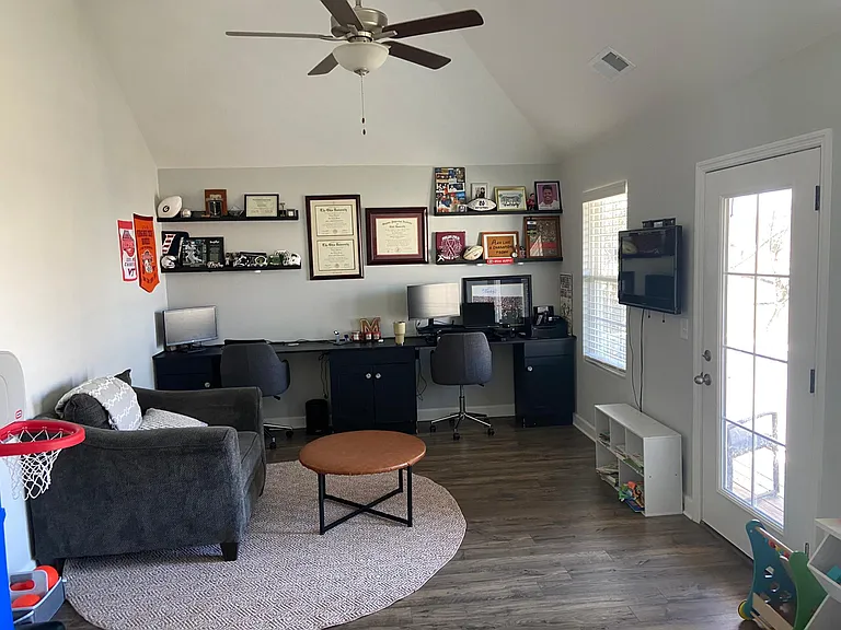 Bonus room with custom-built two-person desk with cabinets