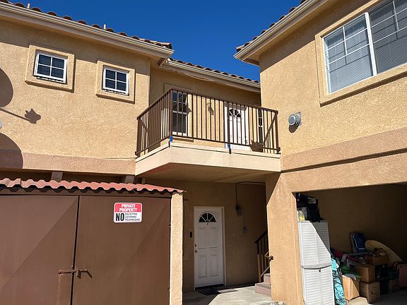 Balcony by front door of unit