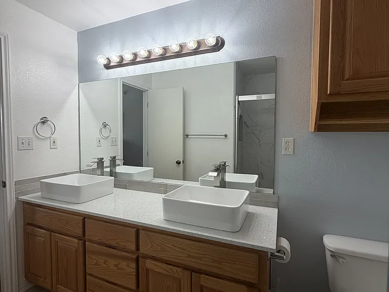 Primary bathroom with double sink vanity.