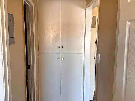 Hallway with linen closet