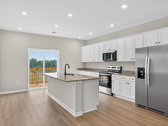 The kitchen comes with stainless-steel appliances.