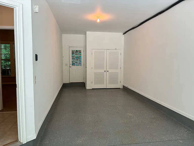 Part of the garage leading to the patio
