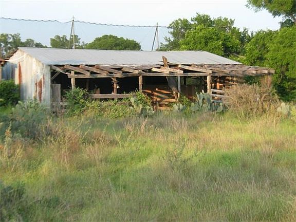 Abandoned barn/stable on property