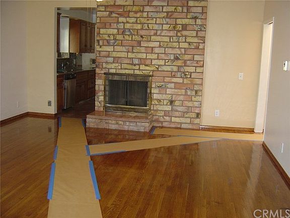 Living room with fireplace & refinished hardwood floors
