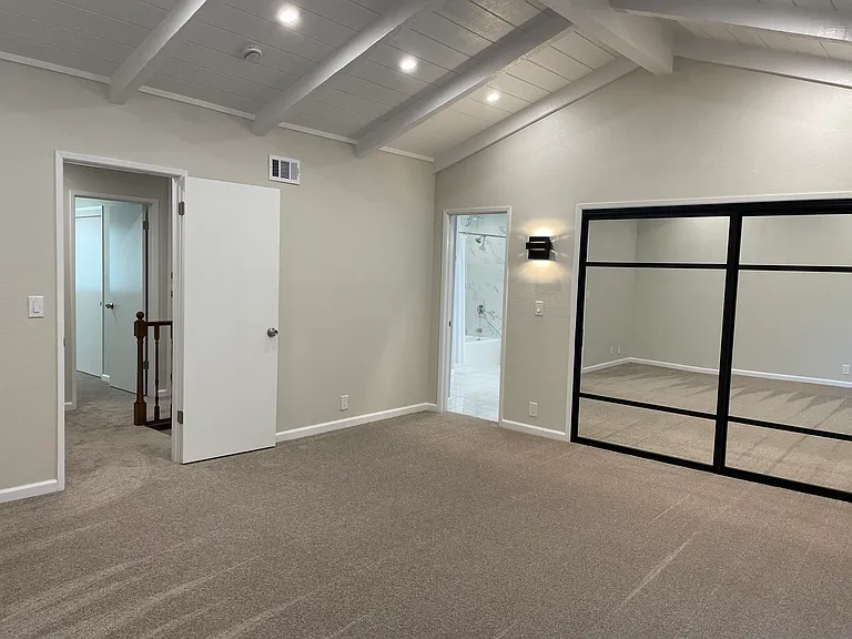 Master bedroom, very large and spacious, with dimmable recessed lighting and vaulted ceiling.