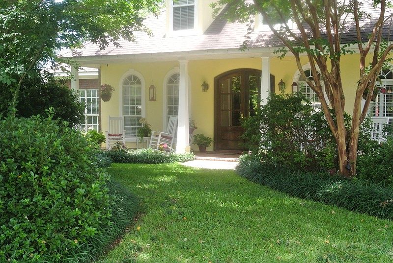 Front Entrance : Covered Tiled Front Porch and Mahogany Beveled Glass Double Doors