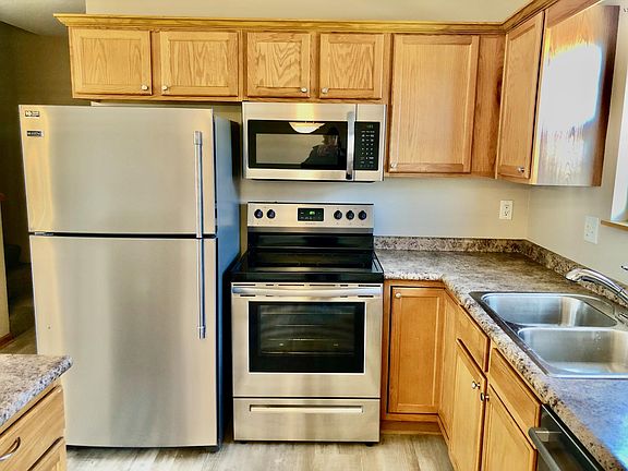 Kitchen with brand new or newer appliances, double sink, new disposal, quiet Bosch dishwasher, island with drawers and cabinets and the ability to use with counter stools.
