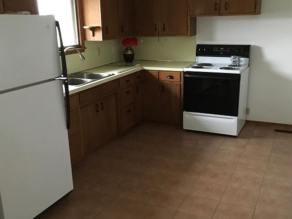 Trendy kitchen with NEW gooseneck faucet and ceramic floor