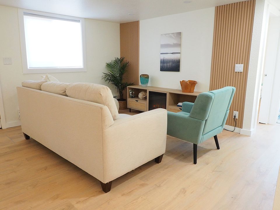Spacious living room with new electric fireplace providing space for your TV and other media components while also offering the ambiance and warmth of a fireplace
