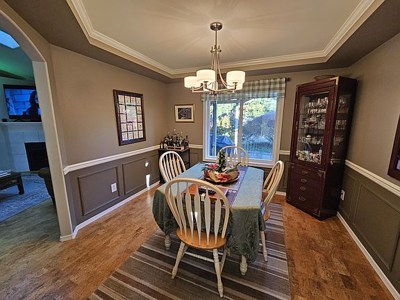 Beautiful detail in wainscoting dining room walls and elegant ceiling details.