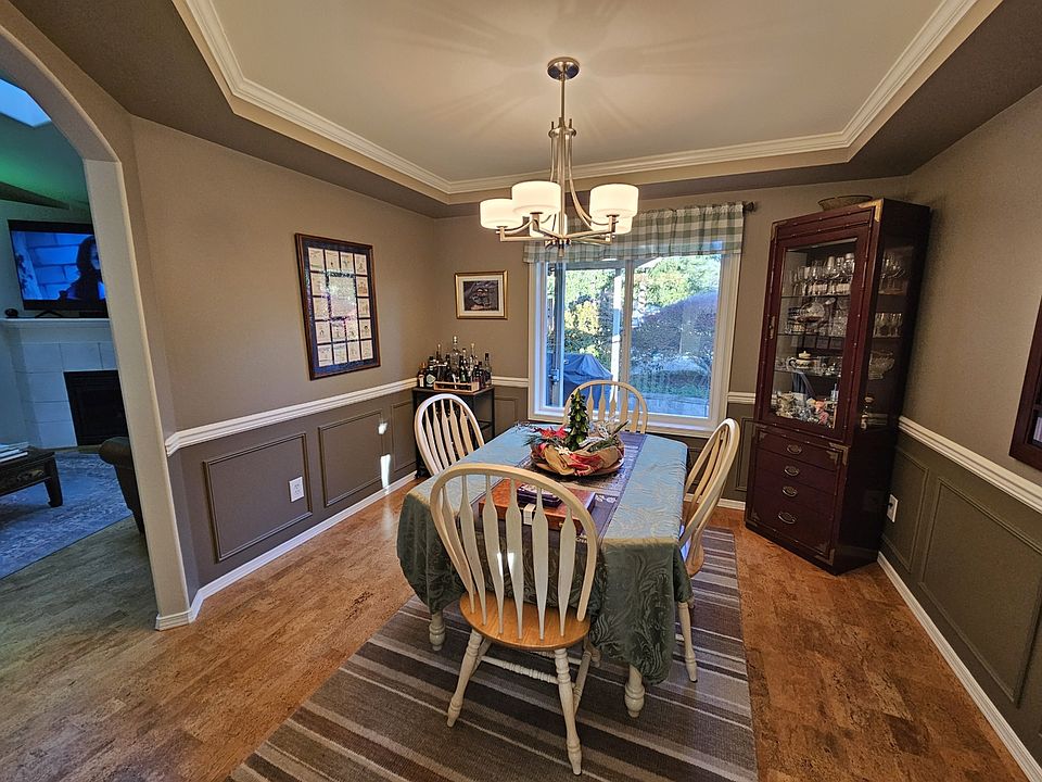 Beautiful detail in wainscoting dining room walls and elegant ceiling details.