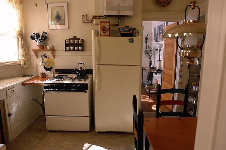 Kitchen, gas stove, pantry, eating table and chairs
