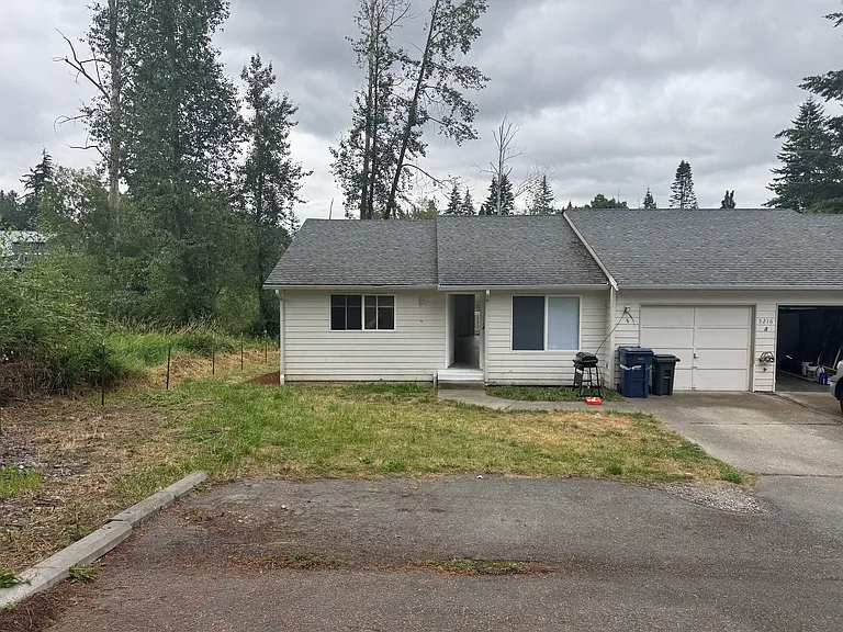 Ample off-street parking with an attached one-car garage and additional driveway space for residents and guests.
