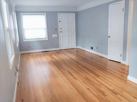 Main living space with refinished original oak floors.
