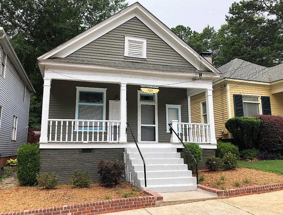 Front view of the house, fresh paint and landscaping
