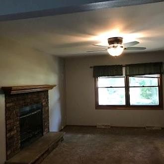 living room with natural working fireplace