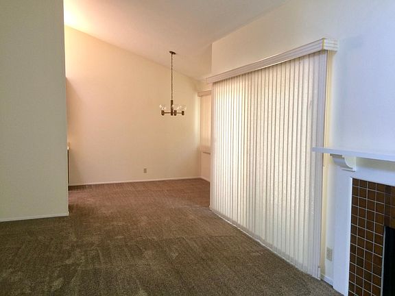 view from living room toward dining room and kitchen