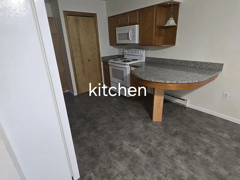 Kitchen view to utility closet
