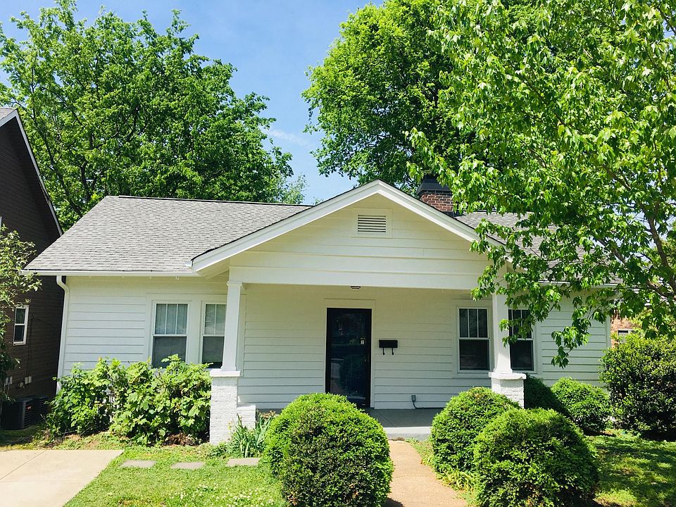 Front porch is a nice place to drink your morning coffee. Or walk a couple short blocks to several different coffee shops. Parking pad is shown on the left.