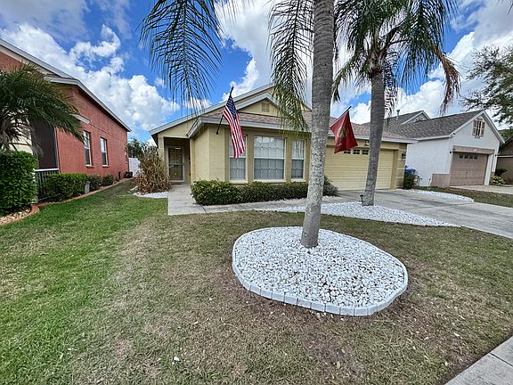 Front of House With Palms