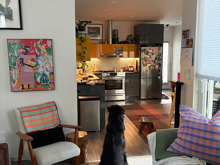 View from the living room into the kitchen/dining area