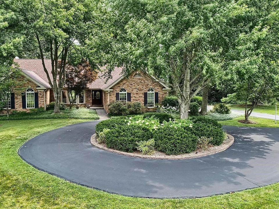 Beautiful curb appeal, circle drive and 3 car side entry garage.