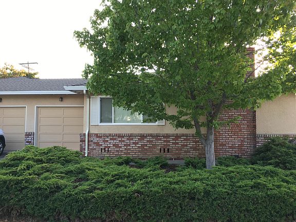 Plaza court frontage with separate garage doors