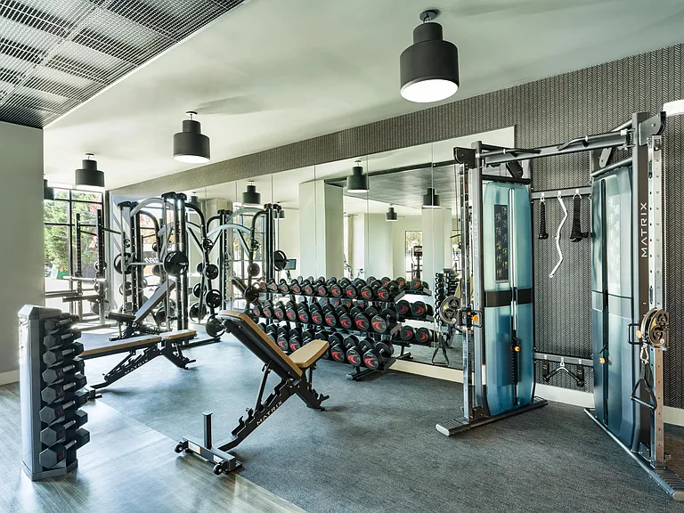 A well-equipped fitness center with strength training, free weights, and open space designed to support a wide range of workouts and routines.