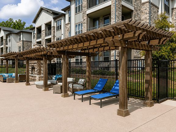 Relax in the shade or unwind beside the refreshing community pool.