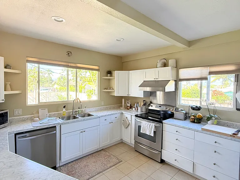 Spacious and bright kitchen overlooking garden and the ocean-side