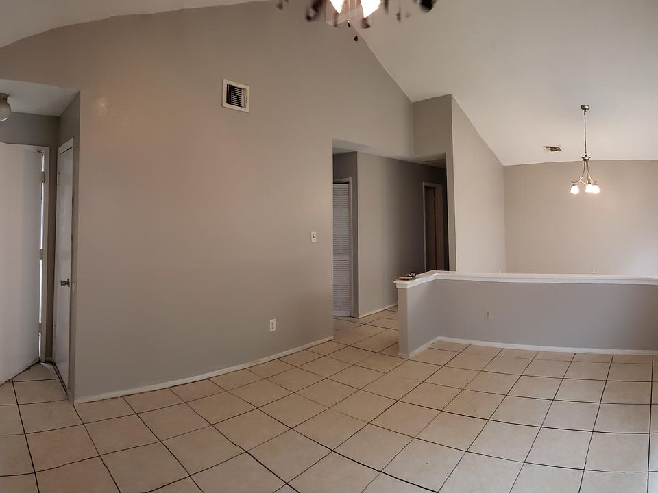 An open concept living room with high ceilings