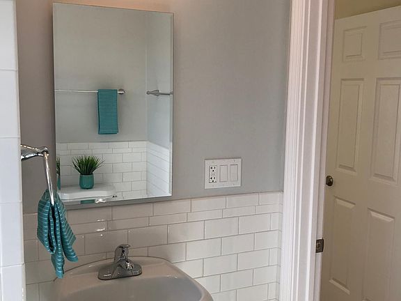 Mirror cupboard and outlet near sink