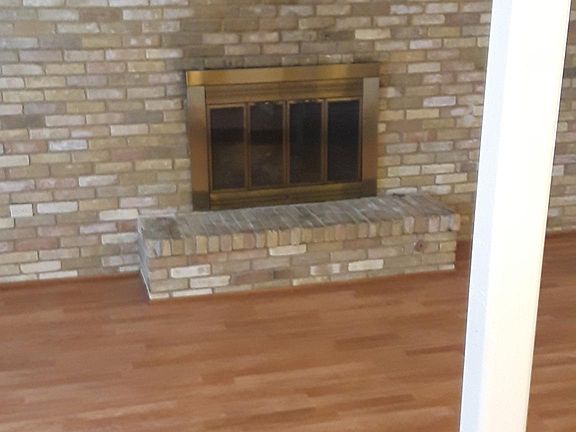 Sunken living room with fireplace