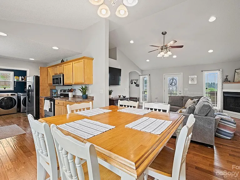 Previous setup for dining area and living room. Walls are now white in the living room and light blue in the kitchen.