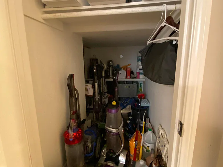 There is a huge closet on the second floor under the stairs leading up to the third floor. You can't tell from this photo, but the closet extends around the corner.