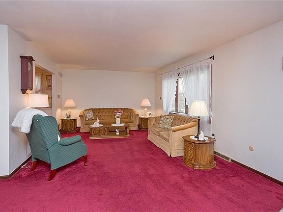 The large living room opens up to the sizable eat-in kitchen and dining area which is perfect for entertaining.