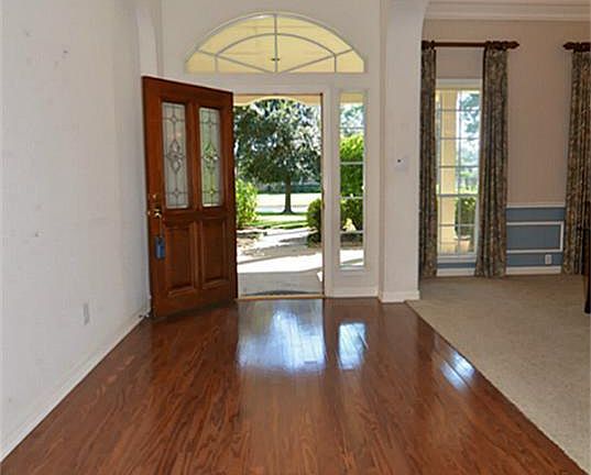 Welcome to your next home! Richly stained hardwood flooring flows from the entrance, kitchen, breakfast and family room.