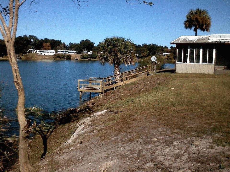 view of lake dock enclosed porch