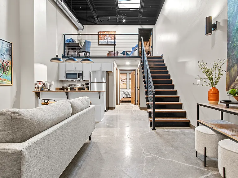 ...enhanced by a skylight that floods the space with natural light. Modern design meets functional living in the heart of downtown.