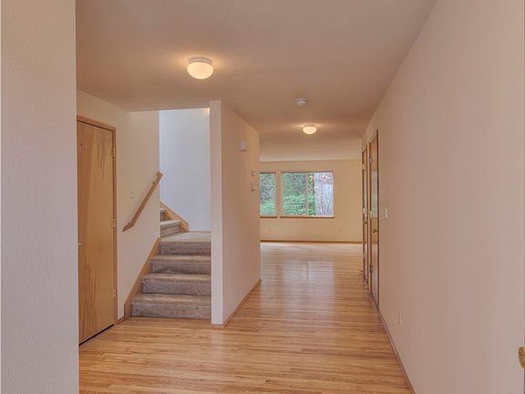 Enter to refinished hardwoods & freshly painted interior. 