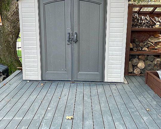 Backyard deck with shed