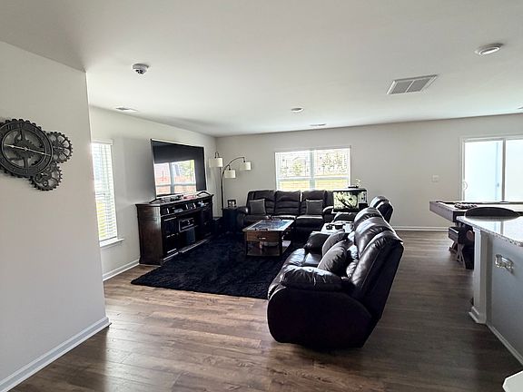 Open floorplan with living room and dining area combined for gatherings and entertainment.